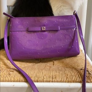 Kate Spade purple polyvinyl cross body bag.